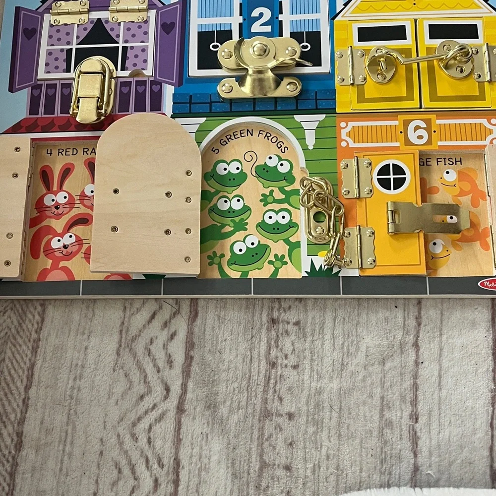 Melissa & Doug Busy Town Locks Board - Purple, Blue, Yellow, Red, Green, Orange